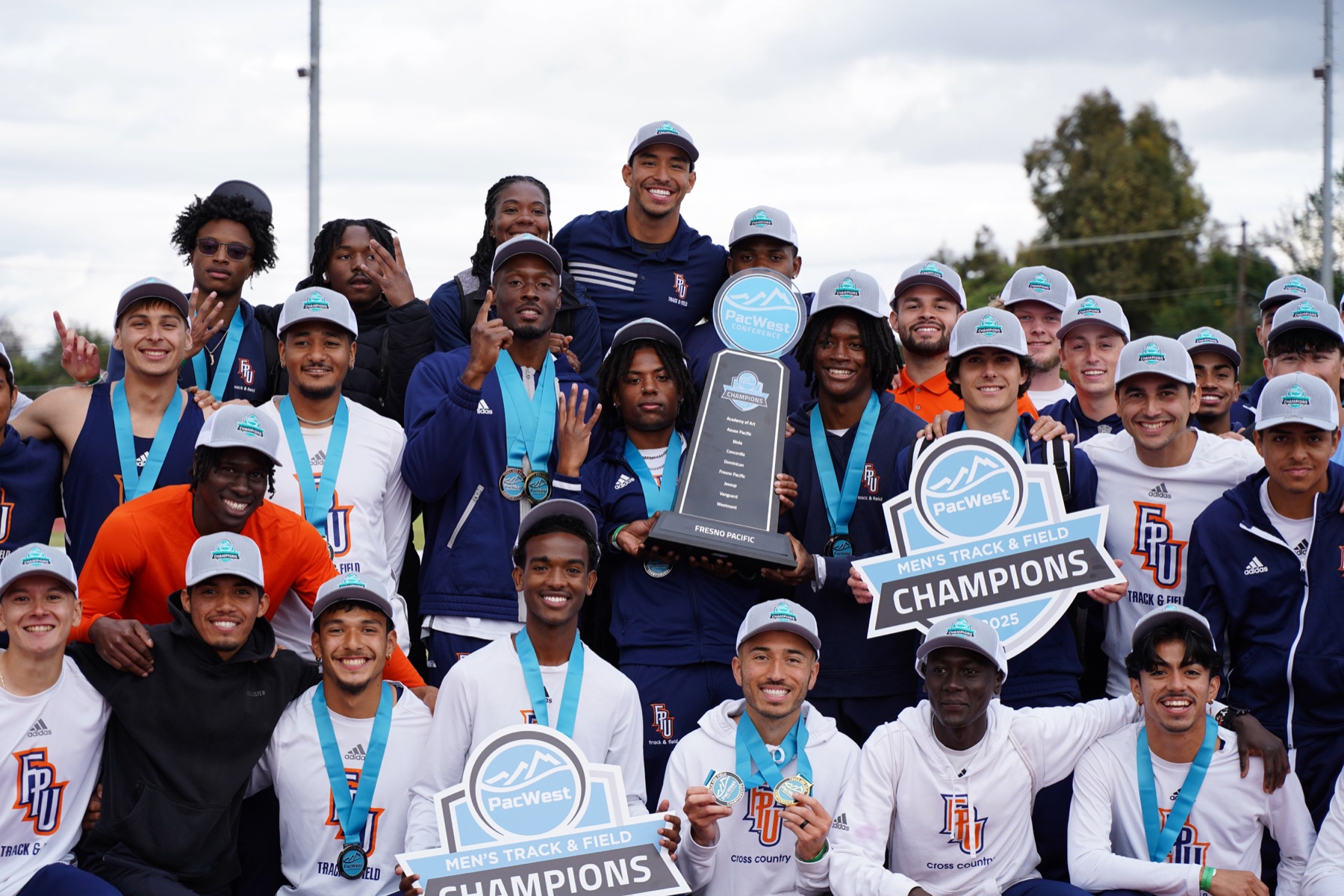 Fresno Pacific men's track and field team celebrating a PacWest championship